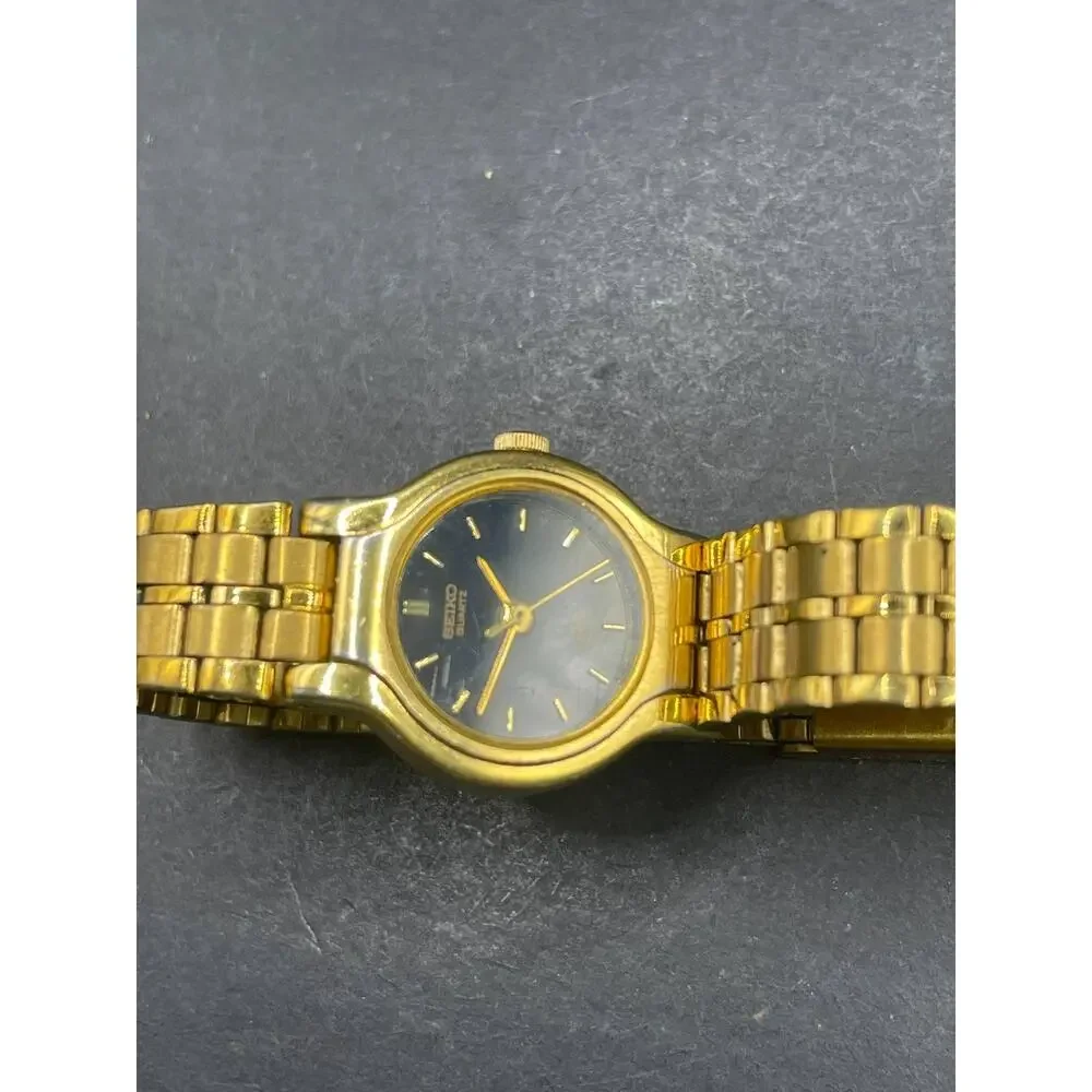 Seiko SX V401-0091 Womens Quartz Wristwatch Gold Tone Black Dial Vintage